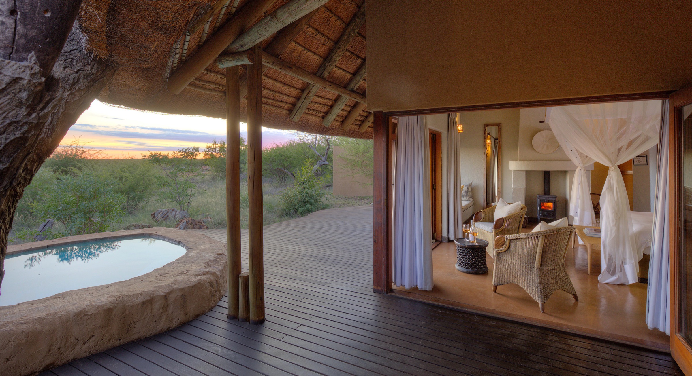 Private Rhulani chalet opening onto a deck and plunge pool in the bush